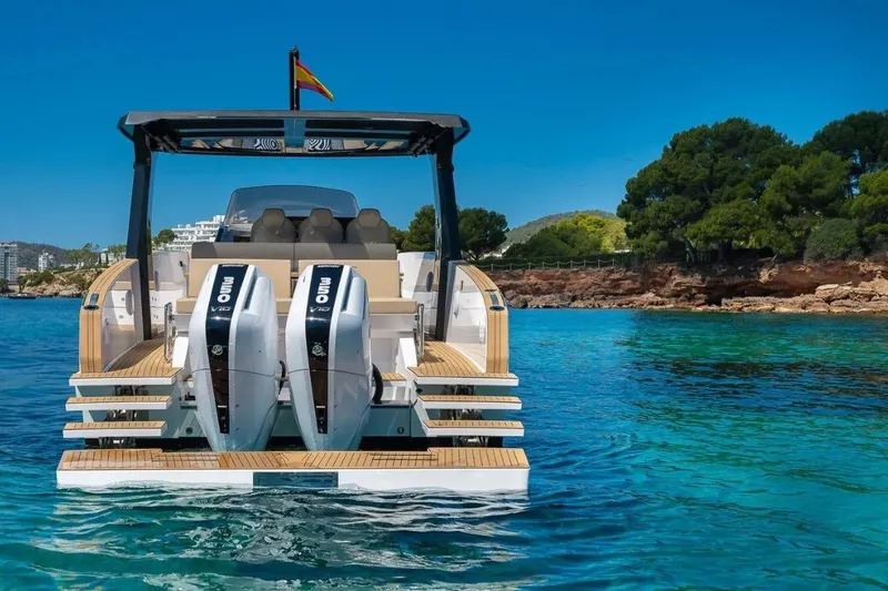 Slide: The Image of Tesoro 40 boat 2026 on clear water with dual engines. - 20