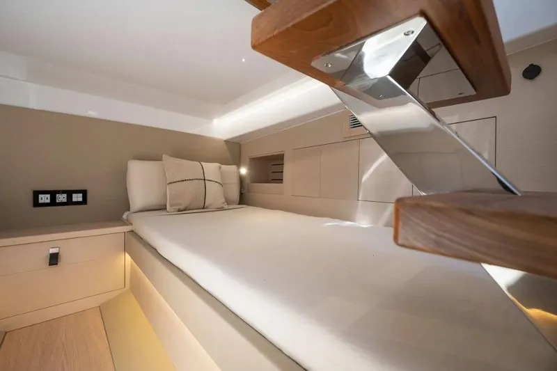 Slide: The Image of Interior of Tesoro 40 yacht, modern bed, year 2026. - 24