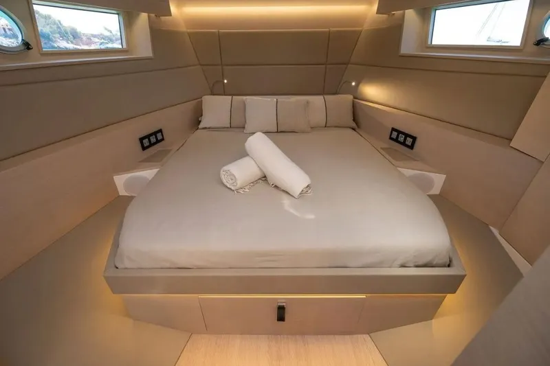 Slide: The Image of Luxurious bedroom in Tesoro 40 yacht, year 2026. - 26