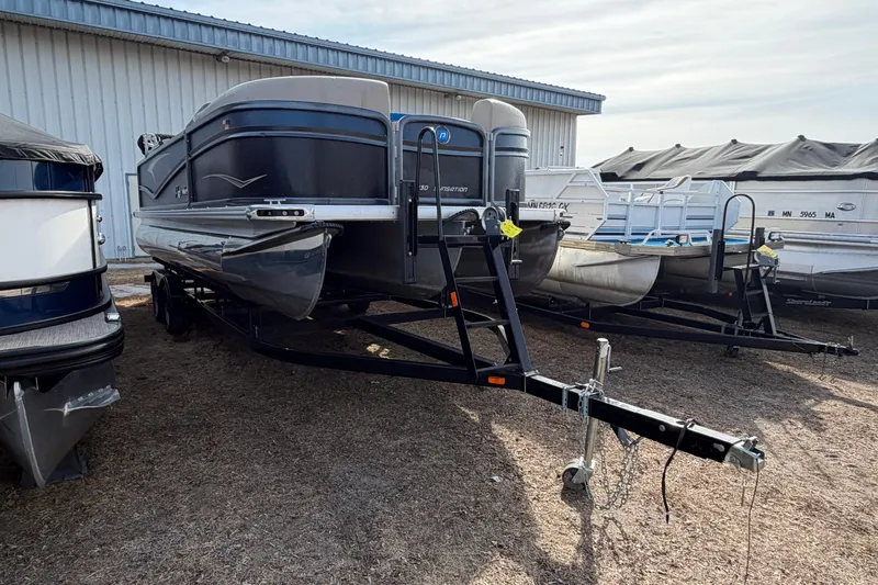 The Image of 2021 Premier 230 Sunsation RF - CL pontoon boat on trailer, parked outdoors. - 1
