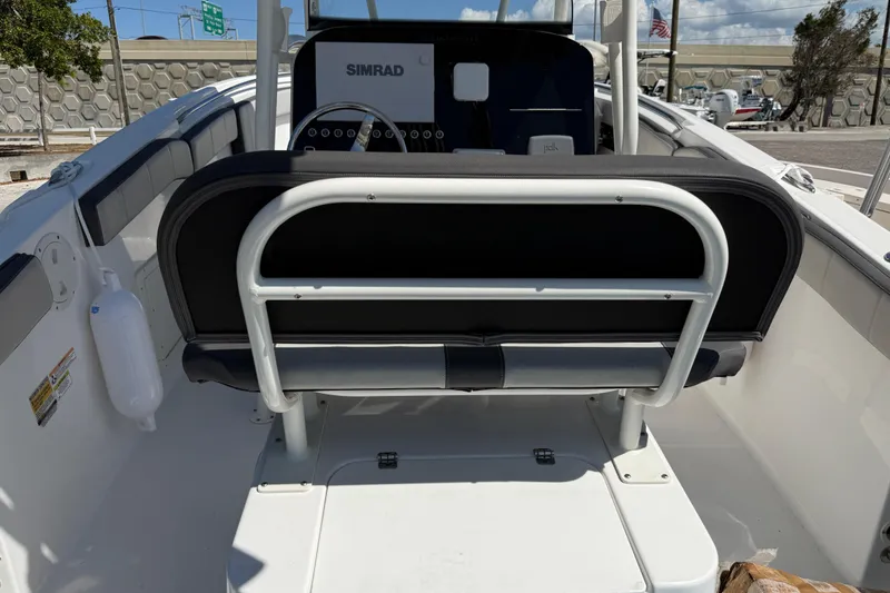 Slide: The Image of 2022 Aquasport 2300 Center Console boat interior with Simrad navigation system. - 5