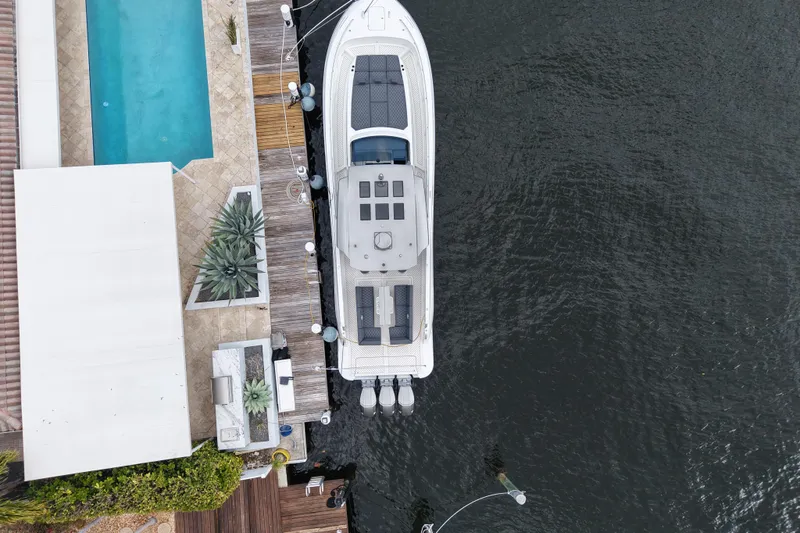 Slide: The Image of Aerial view of 2023 Canados 493 Gladiator yacht docked beside a pool. - 12