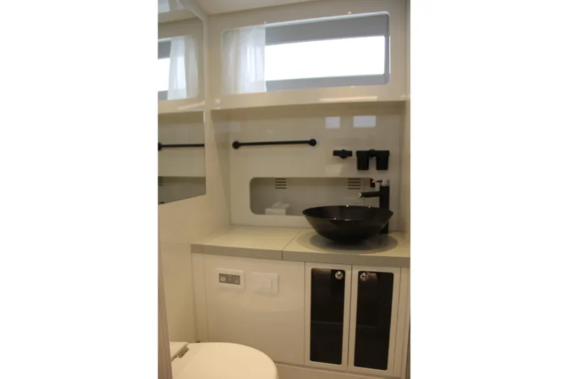 Slide: The Image of Modern bathroom interior of 2023 Canados 493 Gladiator yacht with sleek black sink. - 16