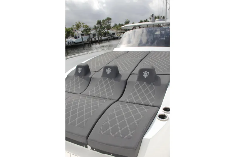 Slide: The Image of Luxurious seating on 2023 Canados 493 Gladiator yacht, featuring elegant gray upholstery. - 3