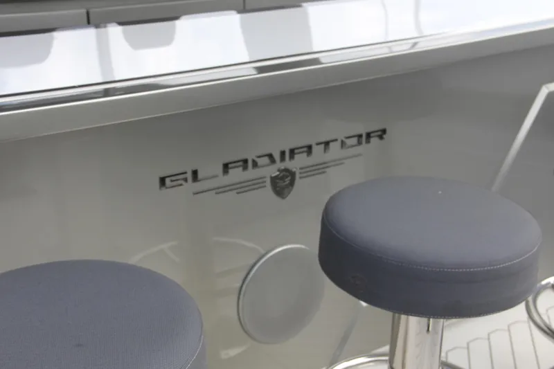 Slide: The Image of 2023 Canados 493 Gladiator yacht interior with bar stools and logo detail. - 5