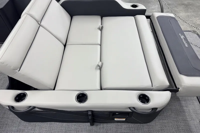 Slide: The Image of 2026 Barletta Cabrio 24UE boat seating with cup holders and sleek design. - 12