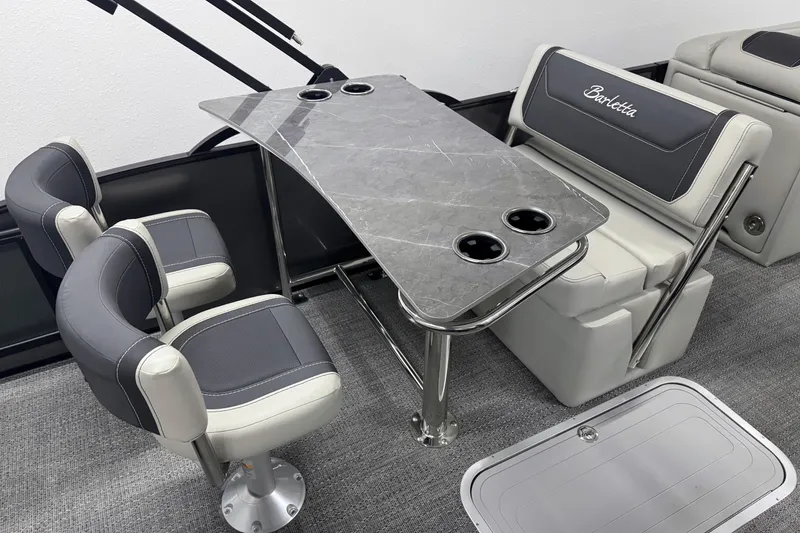 Slide: The Image of 2026 Barletta Cabrio 24UE interior with sleek seating and modern table design. - 17