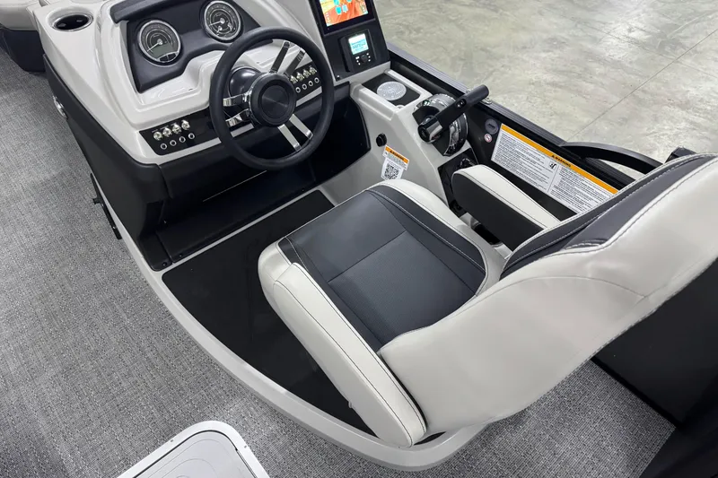 Slide: The Image of 2026 Barletta Cabrio 24UE boat cockpit with modern steering and controls. - 24