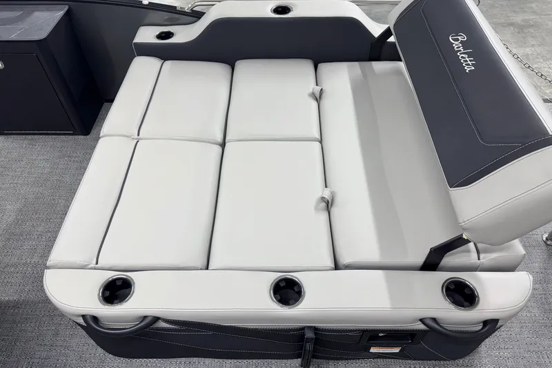 Slide: The Image of 2026 Barletta Cabrio 24UE boat seating with cup holders and sleek design. - 7