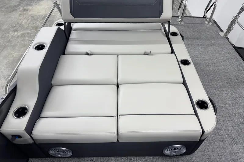 Slide: The Image of Luxurious seating area on 2026 Barletta Cabrio 24UE boat with cup holders and speakers. - 8