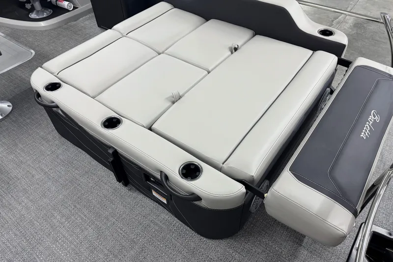 Slide: The Image of 2026 Barletta Cabrio 24UE boat seating with cup holders and sleek design. - 9