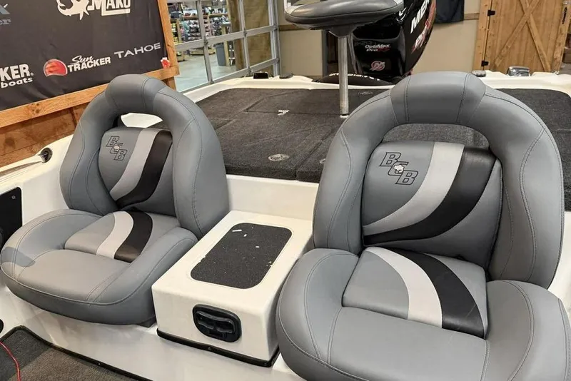 Slide: The Image of 2010 Bass Cat Puma boat interior with gray and black leather seats. - 15