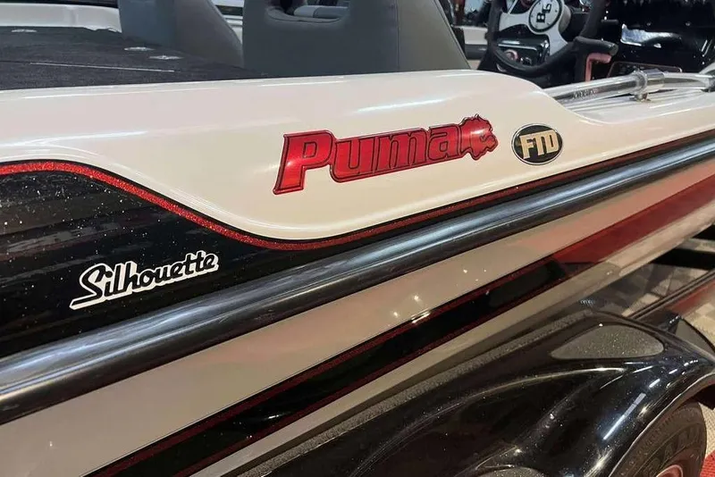Slide: The Image of 2010 Bass Cat Puma FTD boat with Silhouette branding, close-up view. - 19