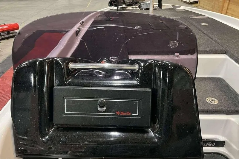 Slide: The Image of 2010 Bass Cat Puma boat dashboard with black finish and storage compartment. - 9