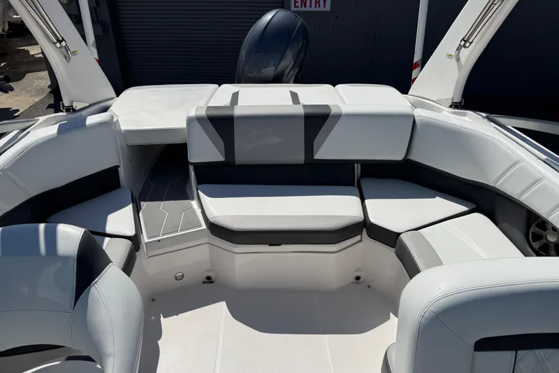 Slide: The Image of 2019 Regal 21 OBX boat interior with white seating and modern design. - 10