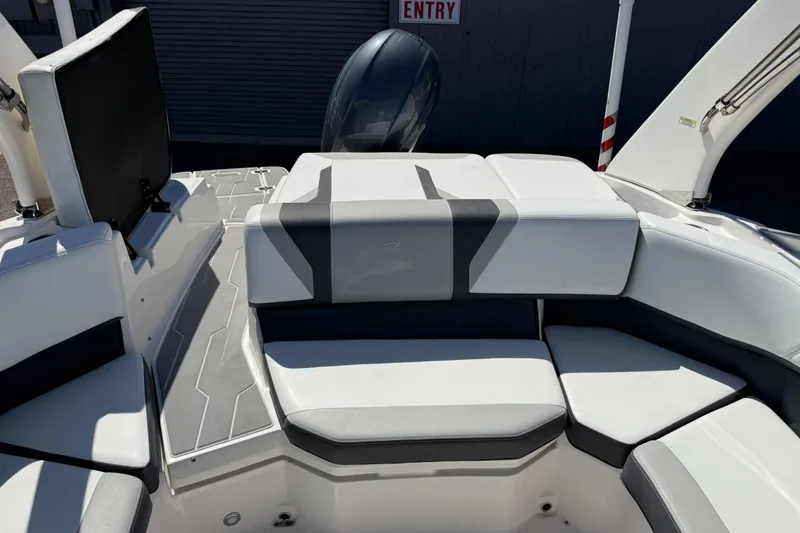 Slide: The Image of 2019 Regal 21 OBX boat interior with cushioned seating and sleek design. - 12