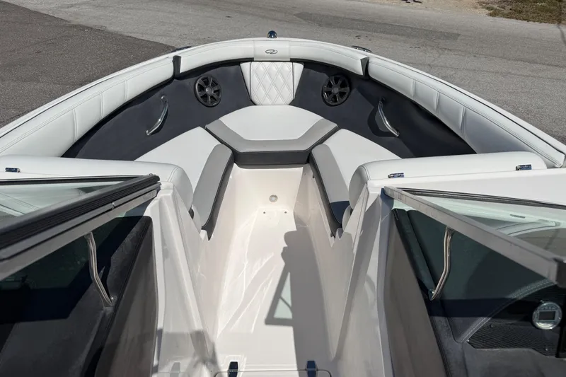 Slide: The Image of 2019 Regal 21 OBX boat interior with white seating and speakers. - 7