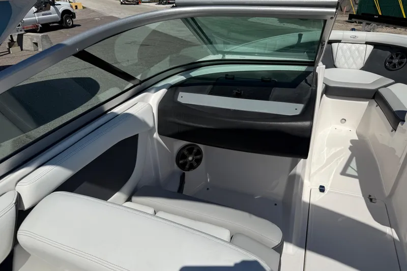 Slide: The Image of 2019 Regal 21 OBX boat interior with white seating and sleek design. - 8