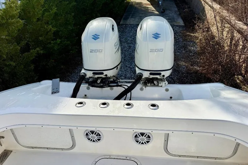 Slide: The Image of 2007 Cape Horn 24 OS boat with dual Suzuki 200 outboard engines. - 4