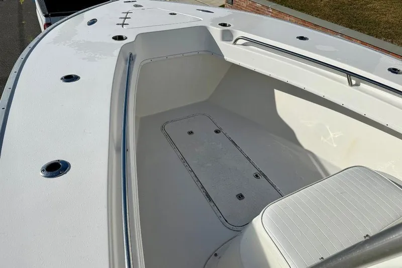 Slide: The Image of 2007 Cape Horn 24 OS boat deck with storage compartment and seating. - 6