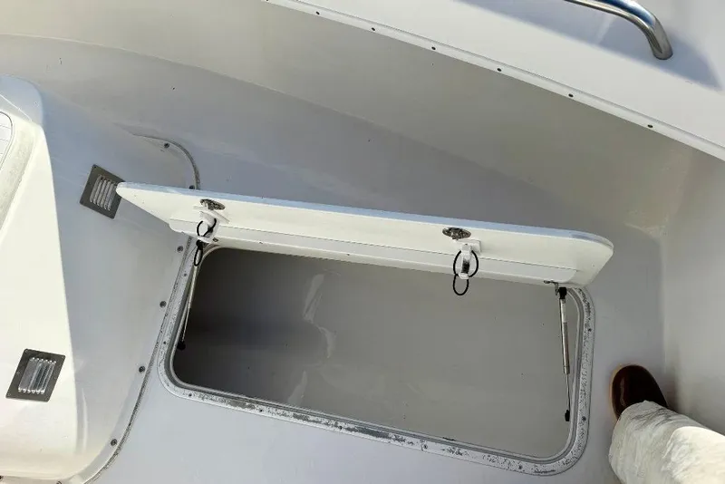 Slide: The Image of Open storage compartment on a 2007 Cape Horn 24 OS boat deck. - 9