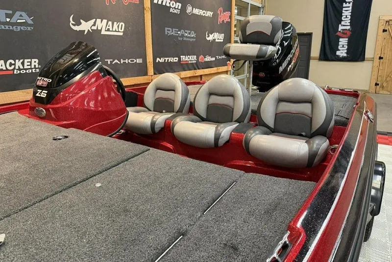 Slide: The Image of 2013 Nitro Z-6 boat interior with three gray and red seats. - 11
