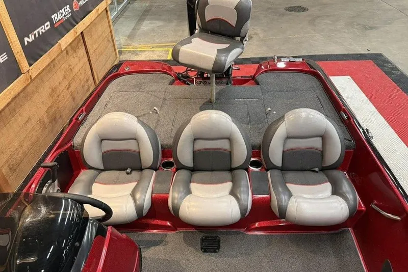 Slide: The Image of 2013 Nitro Z-6 boat interior with gray and red seating arrangement. - 12