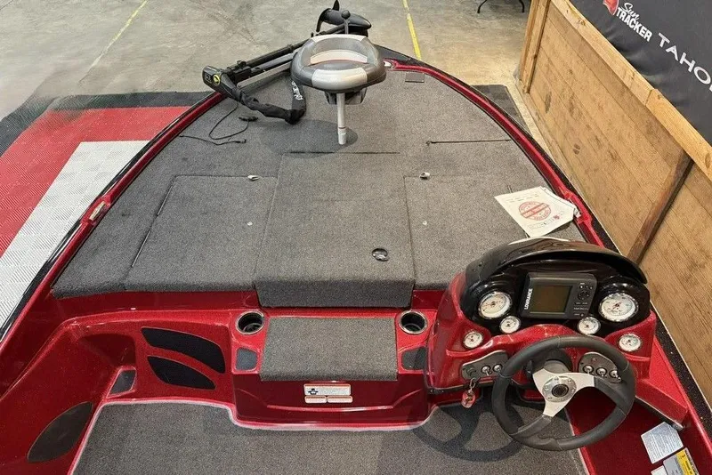 Slide: The Image of 2013 Nitro Z-6 boat interior with steering wheel, dashboard, and seating area. - 3