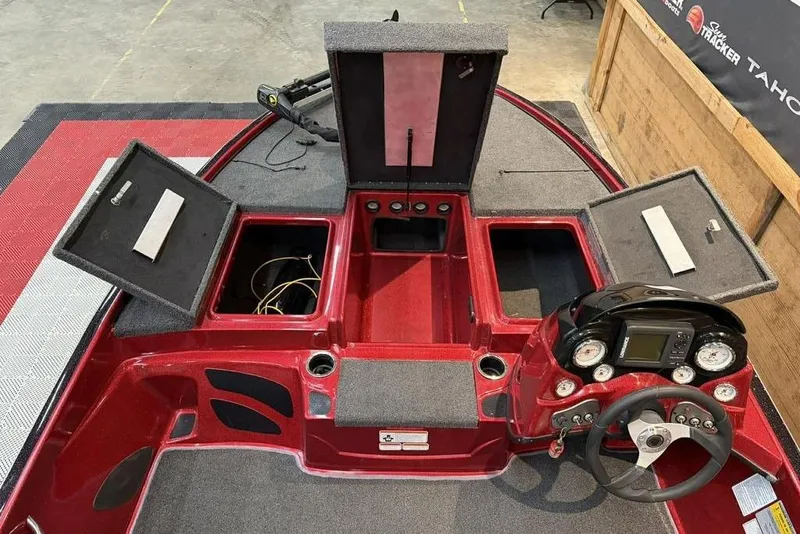 Slide: The Image of 2013 Nitro Z-6 boat interior with open storage compartments and steering console. - 5