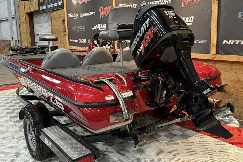 Slide: The Image of 2013 Nitro Z-6 boat with Mercury Pro XS 115 engine in showroom. - 6