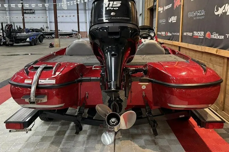 Slide: The Image of Red 2013 Nitro Z-6 boat with 115 Pro motor in showroom. - 8
