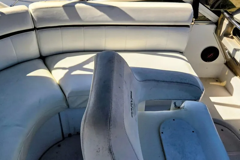 Slide: The Image of Interior seating of a 2000 Carver 396 Motor Yacht, featuring white upholstery. - 16