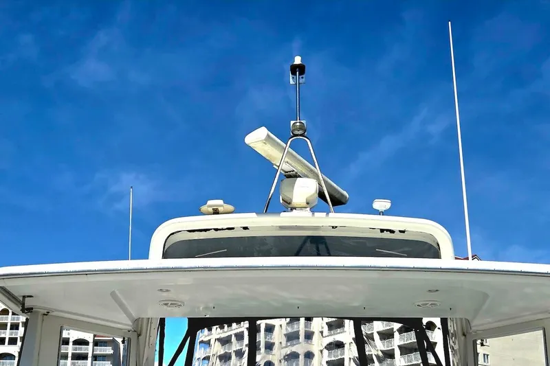 Slide: The Image of 2000 Carver 396 Motor Yacht against a clear blue sky, showcasing radar and antennas. - 20