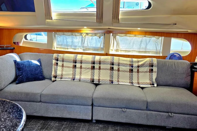 Slide: The Image of Luxurious interior of 2000 Carver 396 Motor Yacht with cozy sofa and elegant decor. - 25