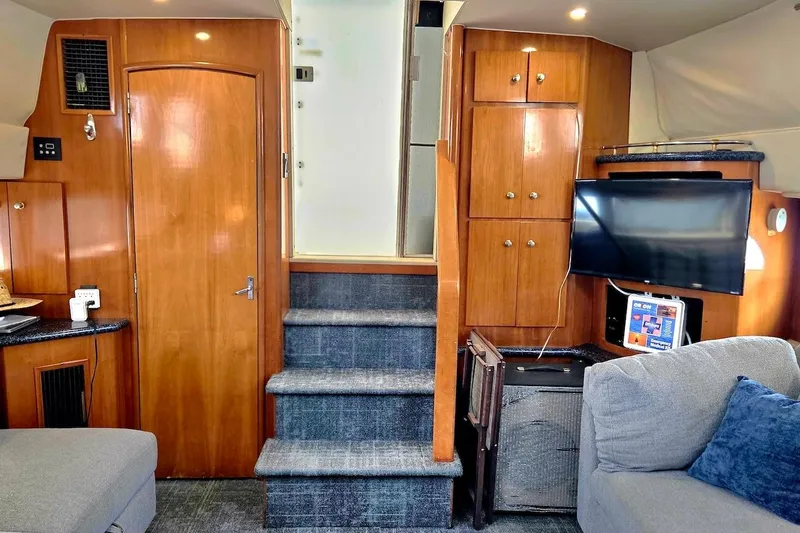 Slide: The Image of Interior of 2000 Carver 396 Motor Yacht with wood cabinetry and modern amenities. - 29