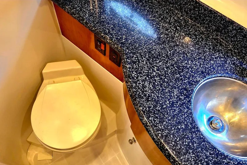 Slide: The Image of Bathroom interior of 2000 Carver 396 Motor Yacht with granite countertop and sink. - 48