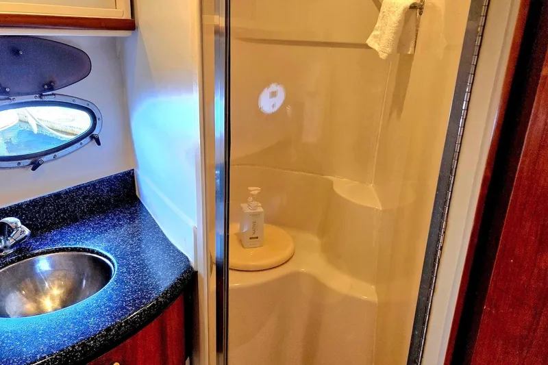 Slide: The Image of Bathroom interior of 2000 Carver 396 Motor Yacht with sink and shower. - 50