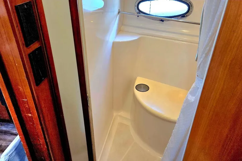 Slide: The Image of Bathroom interior of 2000 Carver 396 Motor Yacht with porthole window. - 54
