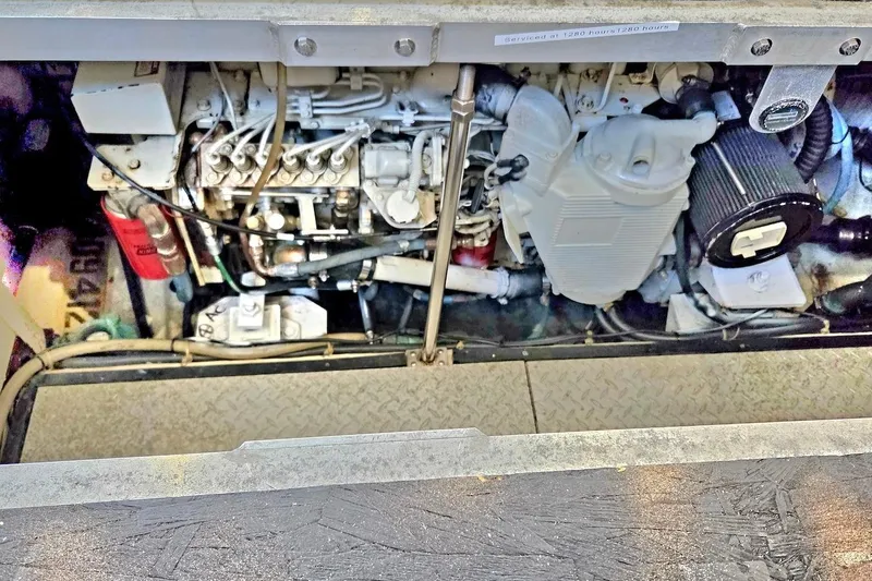 Slide: The Image of Engine compartment of a 2000 Carver 396 Motor Yacht, showcasing mechanical components. - 57