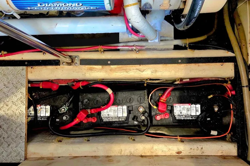 Slide: The Image of Battery compartment of a 2000 Carver 396 Motor Yacht with wiring and components. - 58
