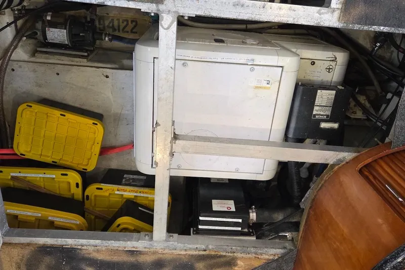 Slide: The Image of Engine room of 2000 Carver 396 Motor Yacht with equipment and storage boxes. - 62