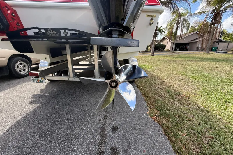 Slide: The Image of 2020 HellKats 30 boat propeller on trailer, parked near palm trees. - 17