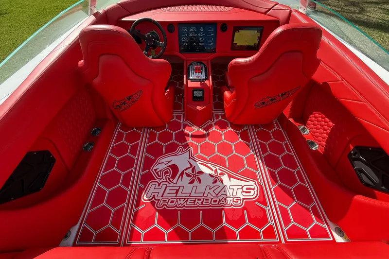 Slide: The Image of Red interior of 2020 HellKats 30 powerboat with logo and modern dashboard. - 24