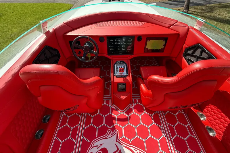 Slide: The Image of Red interior of 2020 HellKats 30 boat with modern dashboard and steering wheel. - 27