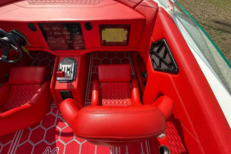Slide: The Image of Red interior of 2020 HellKats 30 boat with modern dashboard and seating. - 28