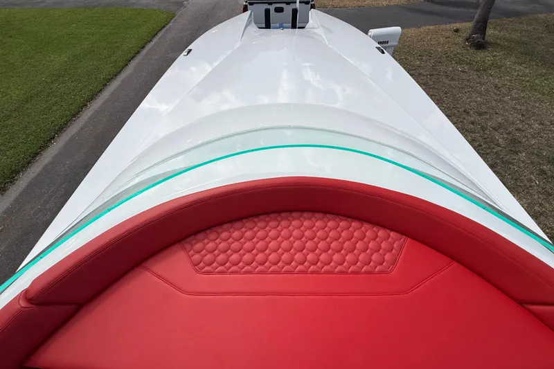 Slide: The Image of 2020 HellKats 30 boat with red seating and sleek white design. - 37