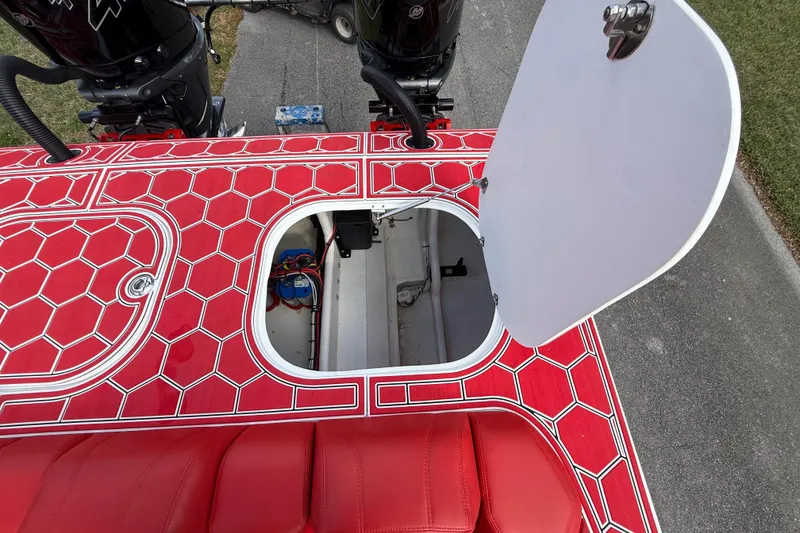 Slide: The Image of Red HellKats 30 boat deck with open hatch, showcasing interior components, 2020 model. - 44