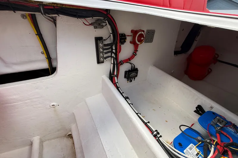 Slide: The Image of 2020 HellKats 30 boat interior wiring and battery setup, showcasing electrical components. - 48