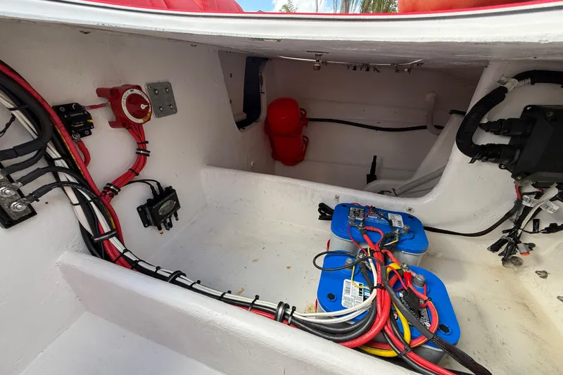 Slide: The Image of Interior view of a 2020 HellKats 30 boat showing wiring and battery setup. - 49