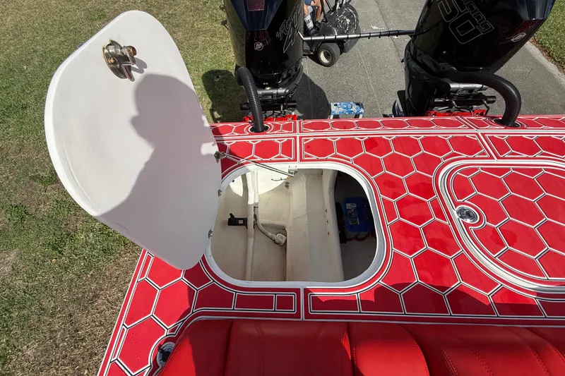 Slide: The Image of Red HellKats 30 boat deck with open hatch, revealing storage compartment, 2020 model. - 50